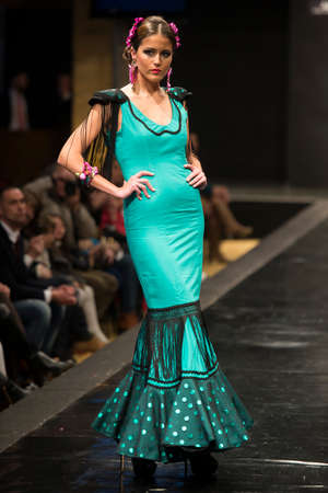 JEREZ DE LA FRONTERA, SPAIN - FEBRUARY 14: Models pictured on the catwalk during the âDoble Bâ Flamenca season fashion show at Pasarela Flamenca Jerez on feb 12, 2015 in Jerez de la frontera.のeditorial素材