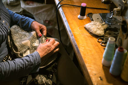 Middle aged woman sewing