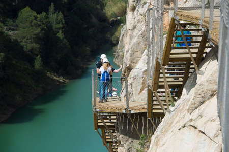 ARDALES (MALAGA), SPAIN - APRIL 17: Tourists walk along the 'El Caminito del Rey' (King's Little Path), World's Most Dangerous Footpath reopened in May 2015 a safer footpath was installed above the original. On apr 17, 2015 in Ardales (Malaga, Spain).のeditorial素材