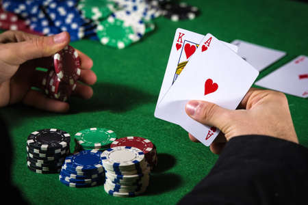 Man in casino with couple of ace and king