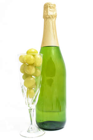 Bottle of champagne with twelve grapes of luckの写真素材