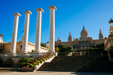 Spain, Catalonia, Barcelona, The Four Columns Puig i Cadafalch, symbol of Catalonia. Each representing the four stripes of the Catalan senyera. In the Background the Royal Palace.のeditorial素材