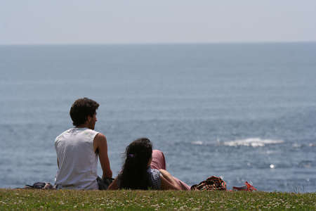 Couple looking the seaの写真素材