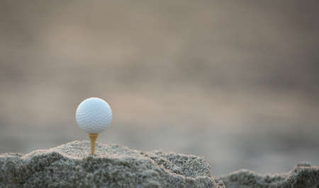 Golf ball in the sandの写真素材