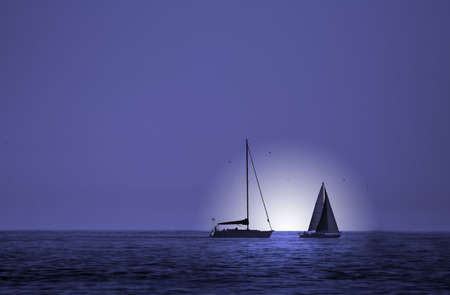 two boats in a blue skyの写真素材
