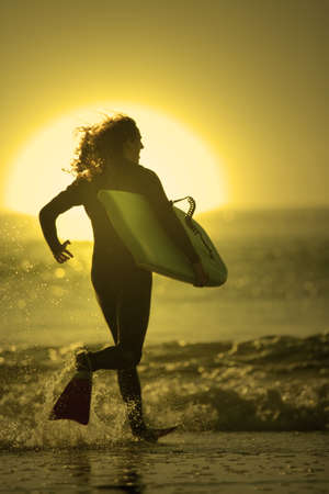 bodyboarder enter in the seaの写真素材