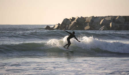 making a Forehand Cutback at sunsetの写真素材