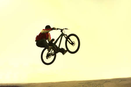 boy making a bicycle jumpの写真素材