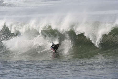 photo of a bodyboarder in the tubeの写真素材