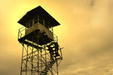 watch tower on sunset sky の写真素材