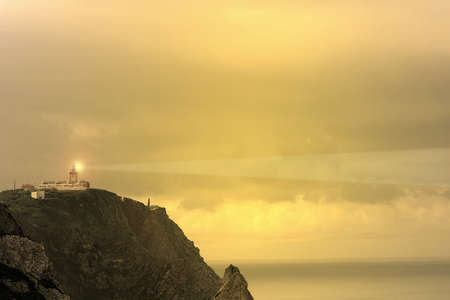 photo of a lighthouse at sunsetの写真素材