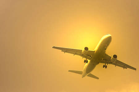photo of a airplane at sunset