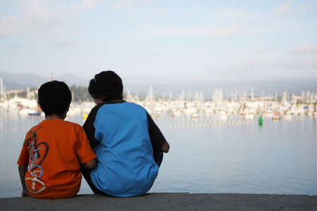 two friends watching the marinaの写真素材