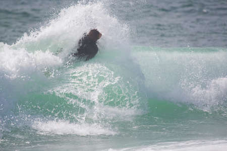 bodyboarder on top of the waveの写真素材