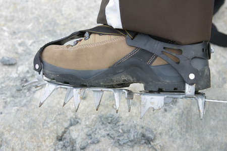 Boot with crampons in ice