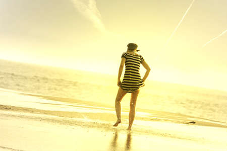 girl in the beach at sunsetの写真素材