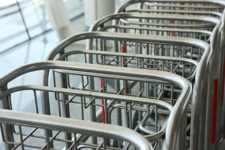 Row of luggage carts in the airportの写真素材