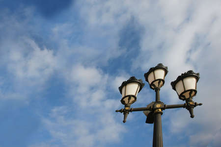 old lamp against blue sky