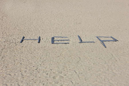 help message in the beachの写真素材