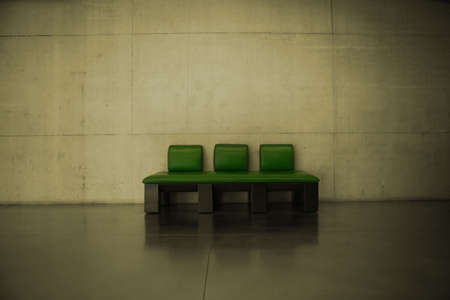 A green leather couch in a dark roomの写真素材