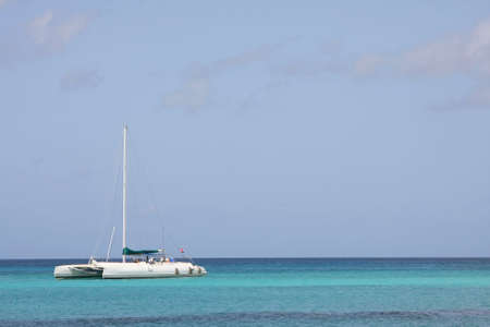 Catamaran in caribbean sea on blue sky backgroundの写真素材