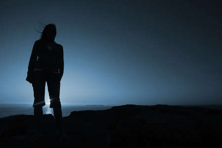 woman silhouette in th mountain の写真素材