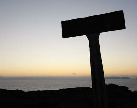 sign silhouette on top of the mountain