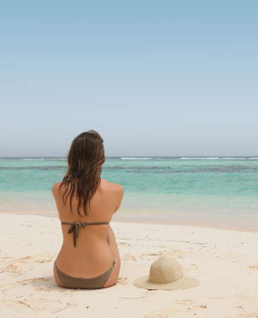 beautiful woman in a tropical beachの写真素材