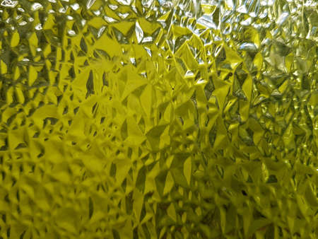 Granulated glass with yellow color, dirty, textured backgroundの素材
