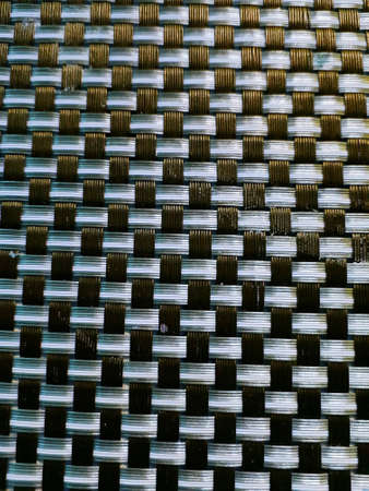 Mexican artisan design, plastic woven in blue and gray colors with black, textured background