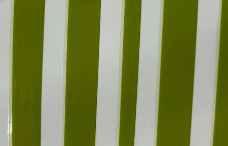 Surface with lines design in olive green with white, textured backgroundの素材