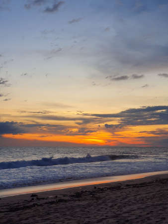 sunset at Pie de la Cuesta beach in Acapulco, Mexico in summer season