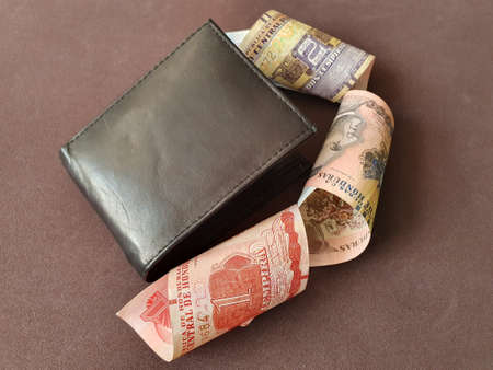 black leather wallet and honduran banknotes of different denominations