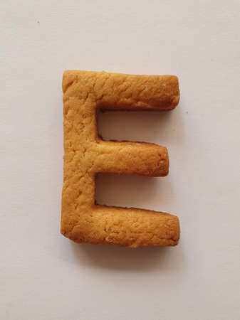 baked biscuit with shape the letter E