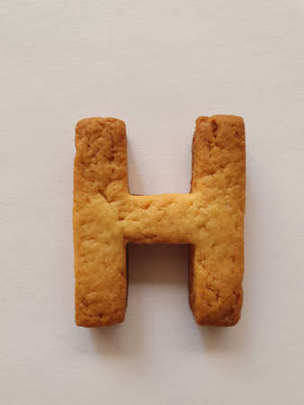 baked biscuit with shape the letter Hの写真素材