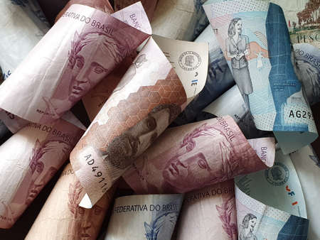 approach to colombian banknotes and brazilian bills of different denominationsの写真素材