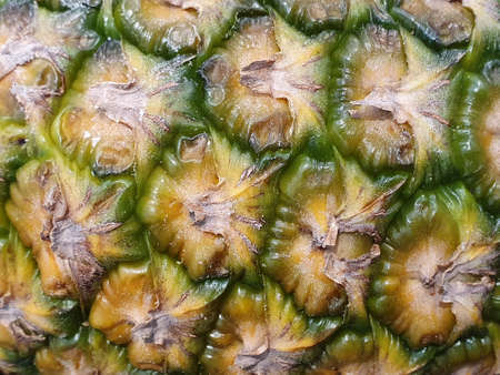 Approach to the pineapple fruit peel, background and textureの写真素材
