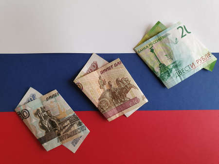 Russian banknotes of different denominations on the background in white, blue and red colorsの写真素材