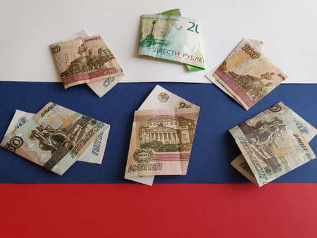 Russian banknotes of different denominations on the background in white, blue and red colorsの写真素材