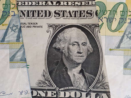 approach to american one dollar bill and Israeli banknotes of twenty shekels