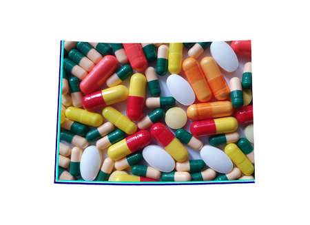 map of Colorado state with medicine pills and white background