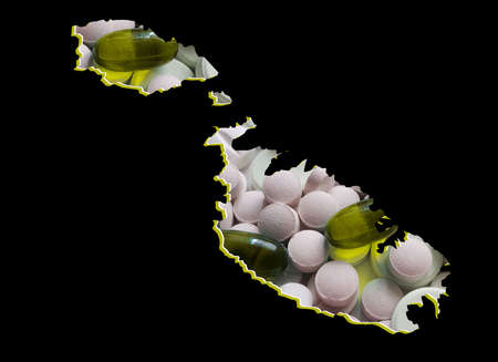 map of Malta with medicine pills and black backgroundの写真素材