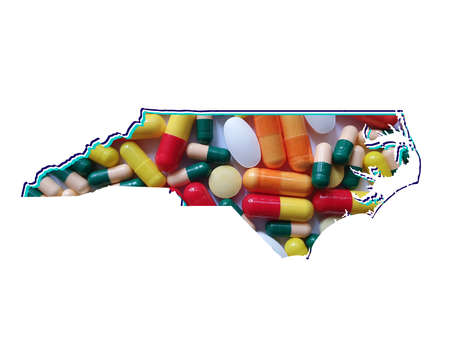 map of North Carolina state with medicine pills and white backgroundの写真素材
