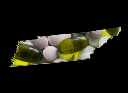 map of Tennessee state with medicine pills and black background