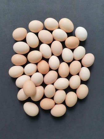 heap of fresh organic egg of brown colors, view from aboveの写真素材