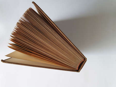 open old book with brown pastes seen from above