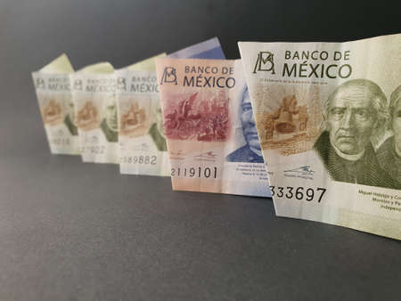 Mexico 500 pesos banknote among the row of 200 Mexican peso bills