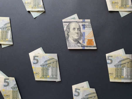 American 100 dollars bill and European banknotes of five euro