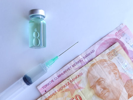 turkish banknotes, syringe and bottle with medicineの写真素材