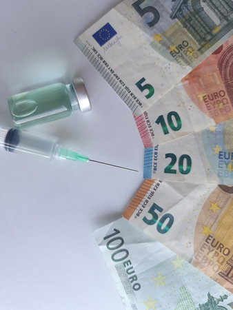 european banknotes, syringe and bottle with medicineの写真素材